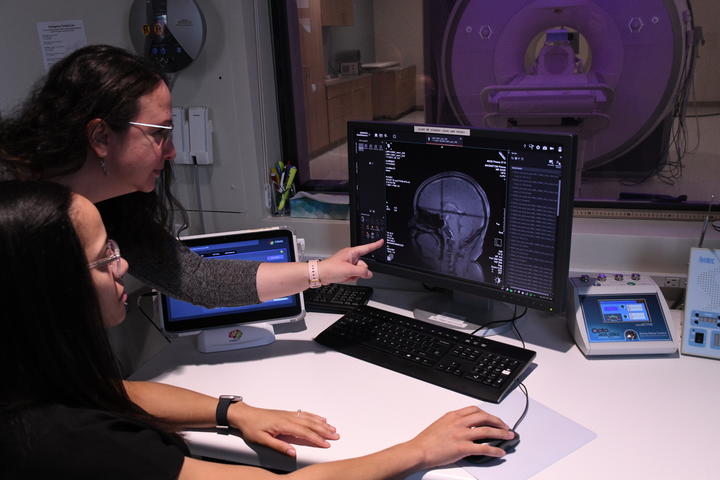 Research staff Dr. Zeynep Basgoze and Michaelle DiMaggio-Potter assessing MRI scan images in the neuroimaging suite at the Masonic Institue for the Developing Brain