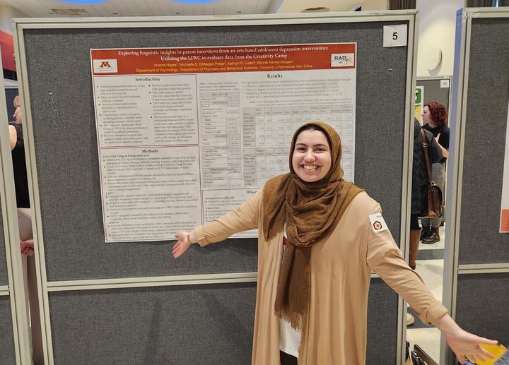 Undergraduate student Shanze Hayee presenting her senior thesis poster at the Spring 2024 Undergraduate Research Symposium.